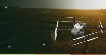 DJI Agras T50 agricultural drone spraying crops in a field for daily acreage and field capacity planning in Canada