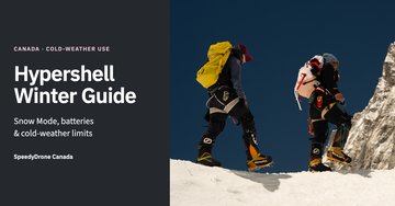 Editorial winter guide cover showing two mountaineers wearing Hypershell exoskeletons on a snowy slope