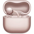 Close-up of a HUAWEI FreeClip 2 Rose Gold earbud resting in the open charging case