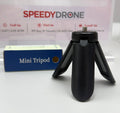 Black mini tripod with SpeedyDrone product packaging