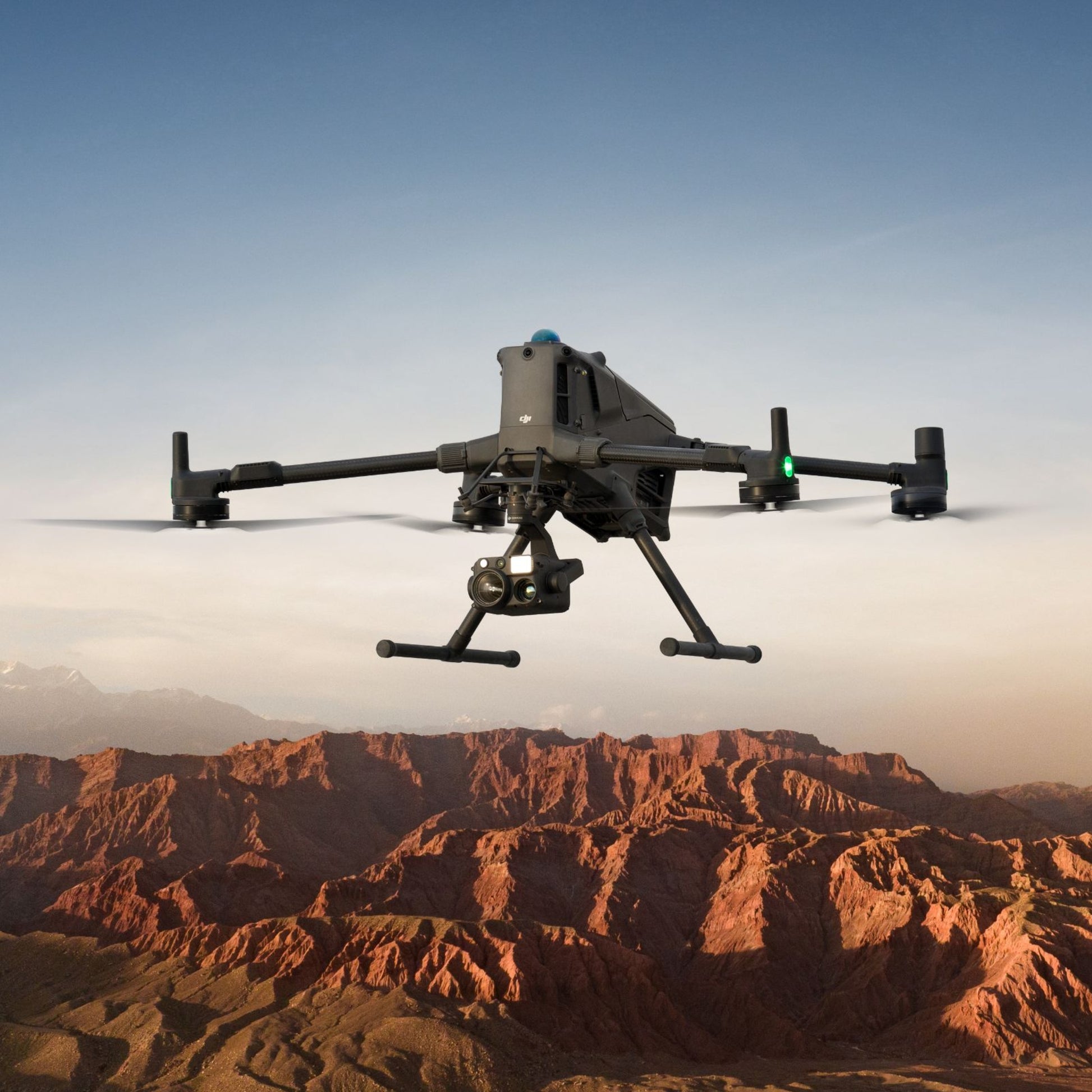 DJI Matrice 400 enterprise drone flying over rugged terrain