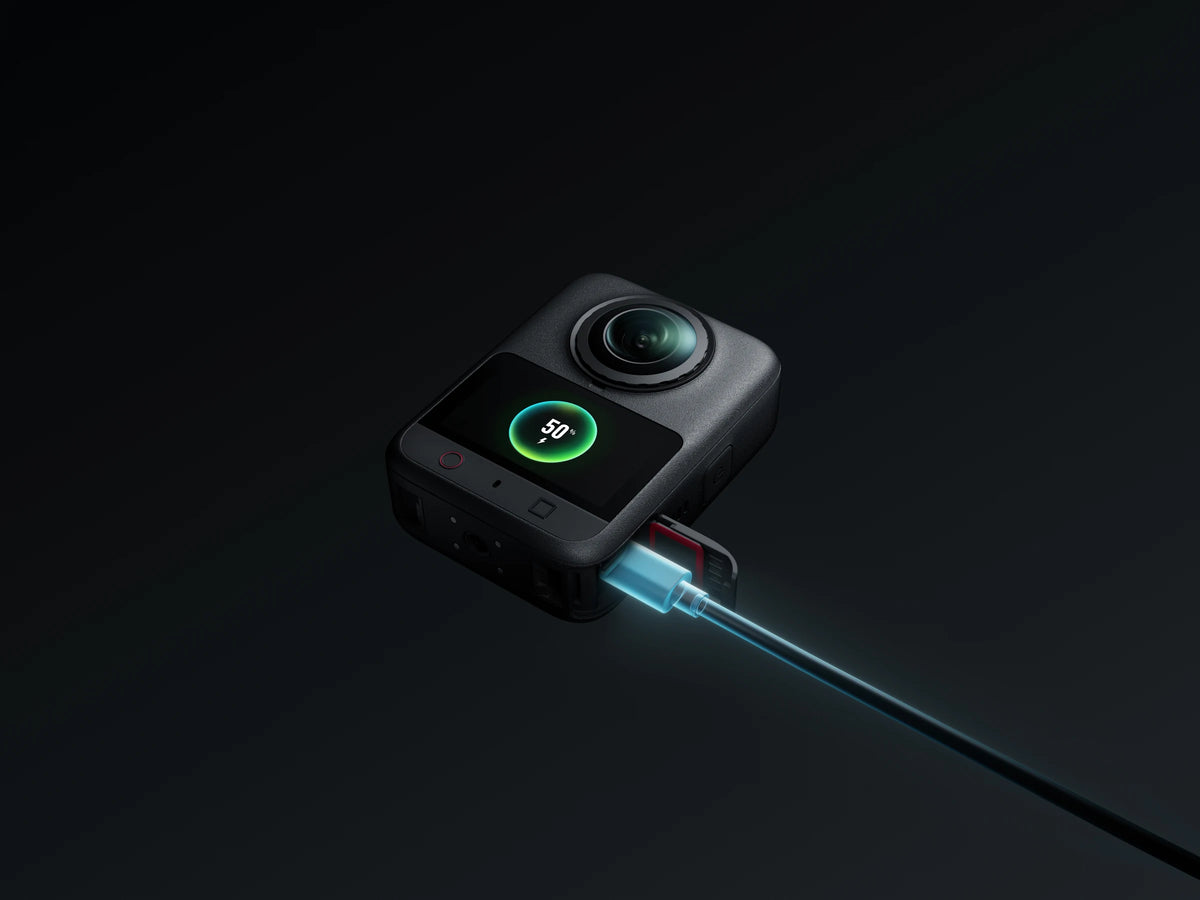 DJI Osmo 360 II render showing a USB-C cable connected for charging