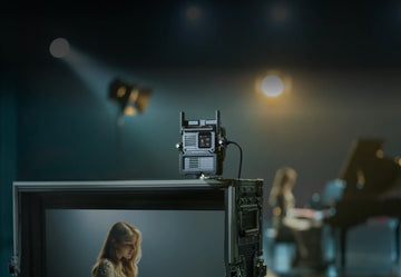 DJI SDR Transmission 2 mounted above a production monitor on a camera set